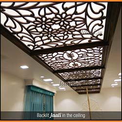 Traditional designed backlit Jaali in the ceiling made out of a combination material ( veneer pasted over MDF ) copy.jpg